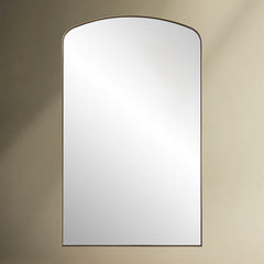 Crafted with a sleek iron frame, this arch mirror features a satin black or brass plated finish that surrounds a floating polished edge mirror.